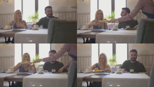 幸福的白种人夫妇在咖啡馆点餐和甜点高清在线视频素材下载
