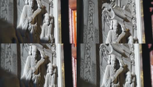在中国寺庙中以晨光为背景的浮雕艺术。宗教艺术的细节高清在线视频素材下载