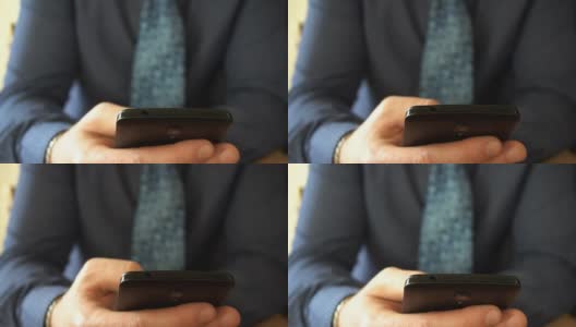 近距离观察一位商人在用他的上一代智能手机浏览信息高清在线视频素材下载