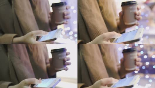 边喝咖啡边走路的女人在智能手机上发短信高清在线视频素材下载