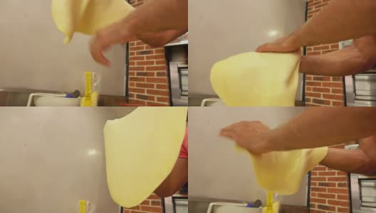 厨师的手把披萨抛向空中高清在线视频素材下载