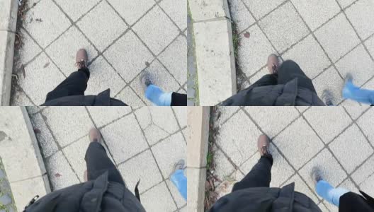 穿着靴子在混凝土上行走的人的POV。对人类慢动作行走的看法高清在线视频素材下载