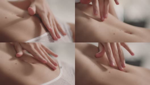 手持拍摄的女人触摸她的腹部皮肤高清在线视频素材下载