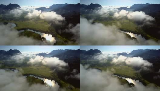 飞行在雾云掩盖绿色山谷高清在线视频素材下载
