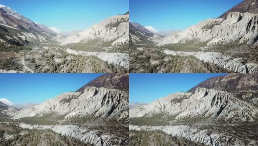 这张照片拍摄于尼泊尔喜马拉雅山脉的Manang山谷的茂密森林。安纳普尔纳的尖峰和贫瘠的山峰在后面。部分被雪覆盖。安纳普尔纳峰电路长途跋涉。大自然的美高清在线视频素材下载