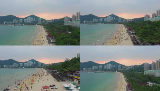 日落天空三亚市风景著名的大东海海滩航拍全景4k中国海南高清在线视频素材下载