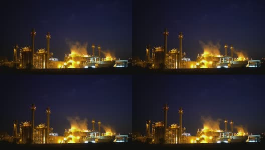 夜景工业发电厂和石油化工厂。4K分辨率高清在线视频素材下载