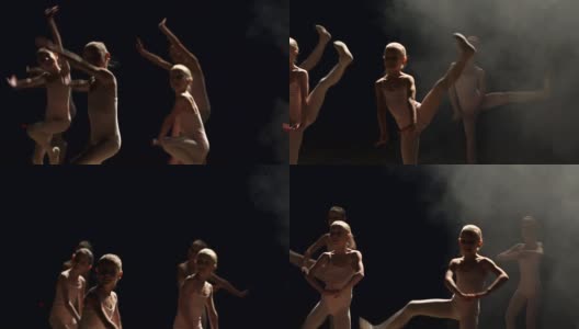 一群芭蕾舞者在黑暗中在舞台上跳舞高清在线视频素材下载