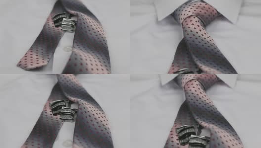 多莉。特写打结的粉红色领带和袖扣上白色衬衫。高清在线视频素材下载