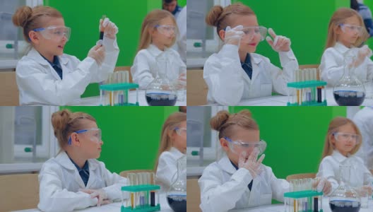 一组孩子在化学课上做实验。教育、儿童、科学和概念高清在线视频素材下载