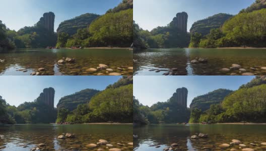 武夷山森林公园 武夷山 T/L Bamboo rafts drifting down Nine Bends River, Yunv peak, Wuyi Mountain, Nanping City, Fujian Province, China高清在线视频素材下载