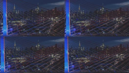 在科修斯科大桥上，曼哈顿中城的夜景。航拍视频与平移摄像机运动。高清在线视频素材下载