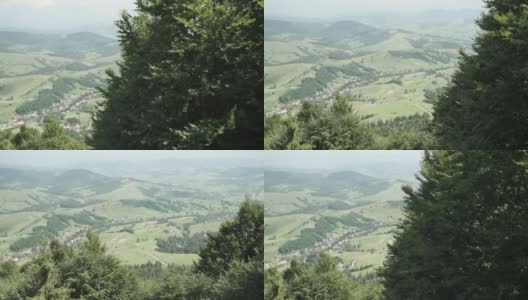 喀尔巴阡山脉美丽的乌克兰村庄，在夏天从缆车上看到树后的山谷高清在线视频素材下载
