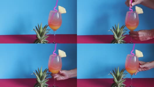 鸡尾酒龙舌兰日出与菠萝为春季和夏季的饮料概念高清在线视频素材下载