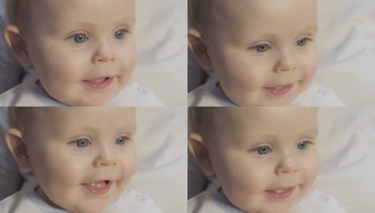 孩子的快乐的表情。蓝眼睛的婴儿看着他的妈妈高清在线视频素材下载