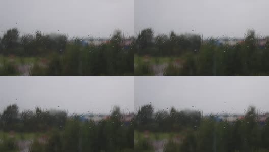雨天透过窗户，以天空和城市建筑为背景高清在线视频素材下载