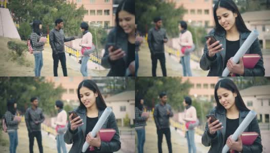 快乐的大学生使用智能手机。高清在线视频素材下载