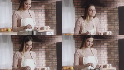 美丽的女人在厨房里做饭高清在线视频素材下载