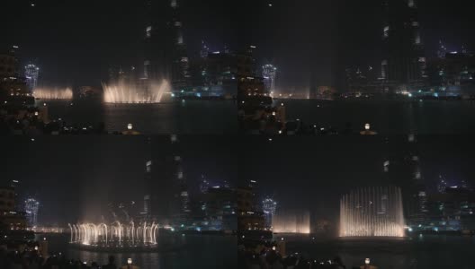 夜城，全景-迪拜舞蹈喷泉。人们观看这个节目。高清在线视频素材下载
