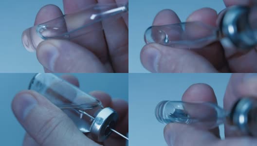 从蓝色背景的小瓶中取出疫苗，装入玻璃注射器。宏高清在线视频素材下载