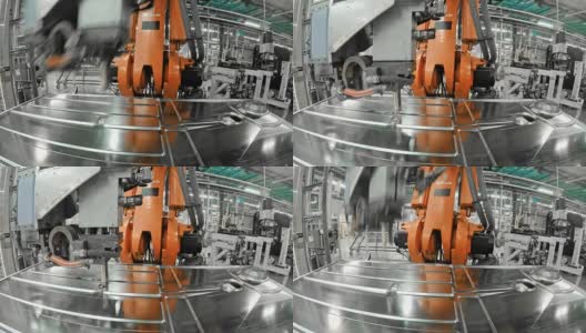 LD工业机器人在工厂里将一个模压的金属板固定在底座上高清在线视频素材下载