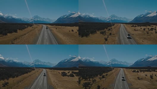 鸟瞰图SUV驾驶在沙漠向雪山山峰在新西兰高清在线视频素材下载