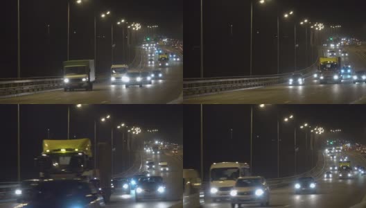 夜间公路交通车辆。傍晚，汽车在桥上行驶。黑暗中的高速公路。加里宁格勒高清在线视频素材下载