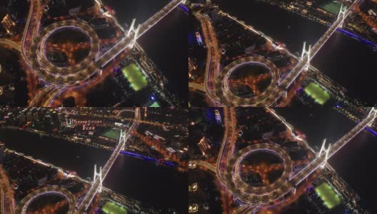 航拍南浦大桥螺旋路交通场景，夜间日落时间与陆上交通概念，中国上海，4k视频高清在线视频素材下载