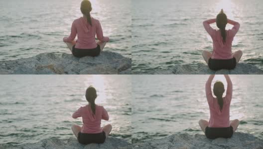 运动亚洲女性坐在冥想姿势姿势医学瑜伽调息平衡在美丽的海滩景色在日出。高清在线视频素材下载