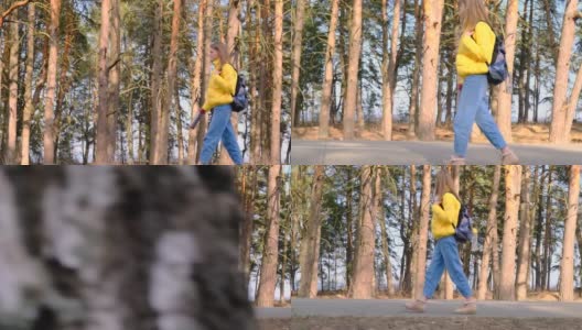搭便车旅行的概念。一名年轻的女游客背着黄色夹克的背包，手里拿着保温瓶，沿着松树林走着。有选择性的重点。慢镜头,4 k高清在线视频素材下载