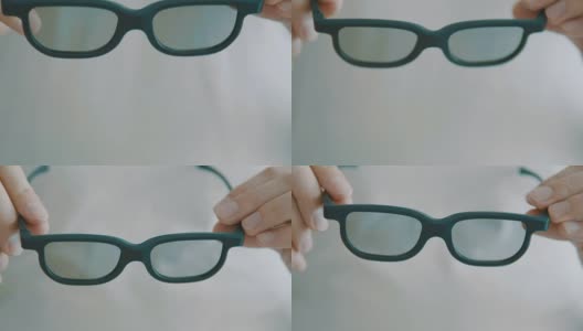 女眼科医生递给病人一副验光眼镜。视力矫正。眼科，优秀的视力或眼镜店的概念。激光手术的选择高清在线视频素材下载