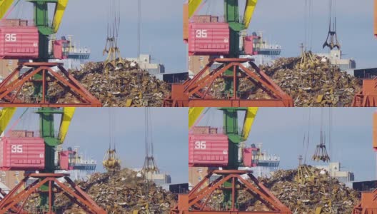起重机抓斗装载回收钢材，加里宁格勒码头。回收、装废金属到港口的船上。高清在线视频素材下载