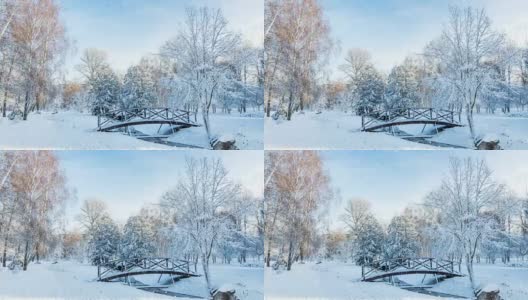 美丽的冬季贺卡与慢动作雪花在城市公园的第一雪与树下在新雪在日出。桥在一个晴朗的日子在冬季城市公园。高清在线视频素材下载