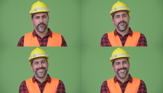 英俊的波斯胡须男建筑工人微笑着高清在线视频素材下载