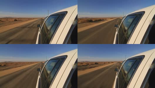 Camera attached on the side of the car driving on deserted highway. POV of car driving on desert road. Car turning right高清在线视频素材下载
