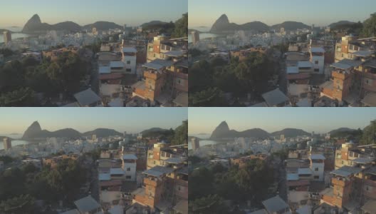 巴西里约热内卢的甜面包山、瓜纳巴拉湾和大洋，冉冉升起的太阳照亮了贫民区的房屋高清在线视频素材下载