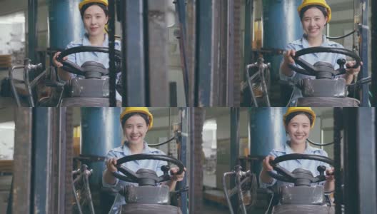 幸福微笑的亚洲女女工在安全帽驾驶叉车在仓库工厂高清在线视频素材下载