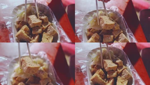 吃臭豆腐的特写高清在线视频素材下载