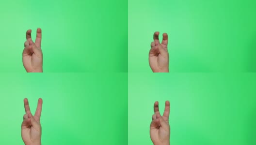 在Chroma Kay背景上竖起大拇指，竖起大拇指的手势。男性的手高清在线视频素材下载