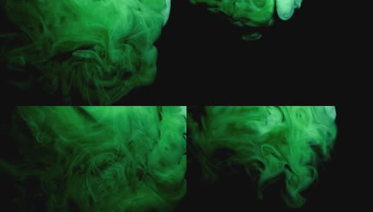 彩色的绿色墨水从上面滴下来，在水中混合，在黑色的背景下轻轻旋转高清在线视频素材下载