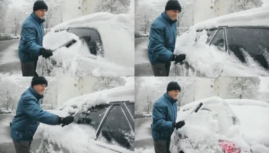 一名男子正在从他的车里清除积雪高清在线视频素材下载