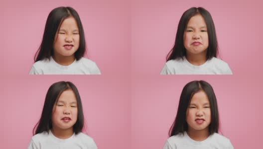 恶心的亚洲女孩闻到臭味臭味皱着眉头的粉红色背景高清在线视频素材下载