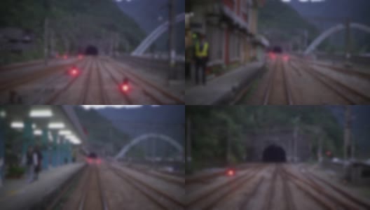 离焦镜头的铁轨火车从一个隧道站在台湾的乡村高清在线视频素材下载