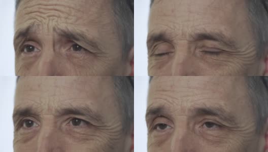 一个老人眼睛的情感肖像，特写，白色背景高清在线视频素材下载