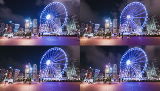 夜晚香港的天际线、渡轮轮盘、游客和现代建筑，时光流逝。高清在线视频素材下载