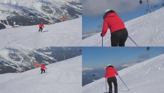 成熟的女子滑雪者滑雪下山坡在山上在冬天和刹车高清在线视频素材下载