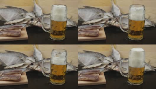 啤酒头安置在一个玻璃马克杯上，背景是鳕鱼高清在线视频素材下载