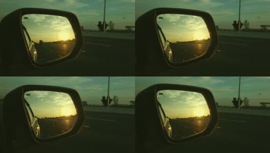 从侧镜看高速公路上的夕阳高清在线视频素材下载