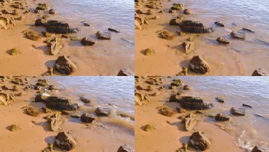 石头岩石悬崖在水中。高清在线视频素材下载