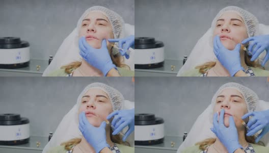 美容师给病人注射肉毒杆菌增加嘴唇高清在线视频素材下载